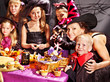 Family on Halloween party with children.