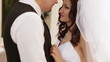 Groom hugs bride