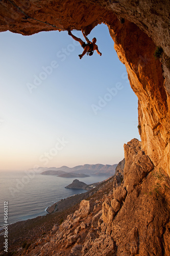 Photo: Rock climber at sunset, Kalymnos Island, Greece Rock climber at sunset, Kalymnos Island, Greece