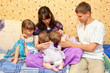 Breast feeding two little sisters twin girls at same time