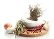 dried herbs in mortar and vegetables, isolatrd on white