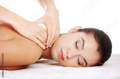Photo: Preaty young woman relaxing in spa saloon Preaty young woman relaxing in spa saloon