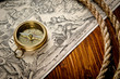 old compass and rope on vintage map 1733