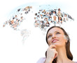 Young woman looking at worldmap with profile photos of her frien