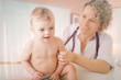 Photo: Female doctor and baby patient. Female doctor and baby patient.