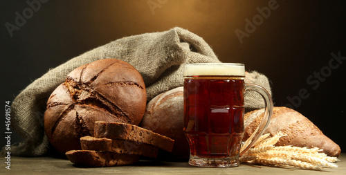 Photo: tankard of kvass and rye breads with ears, tankard of kvass and rye breads with ears,