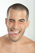 Young man sticking his tongue out