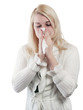 Photo: Blond young woman blows her nose - isolated Blond young woman blows her nose - isolated