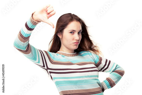 Photo: Girl showing thumb down Girl showing thumb down