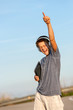 Boy feeling free with headphones and tablet.