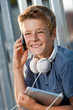 Portrait of smiling boy talking on smart phone.