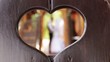 In love with a married couple in a frame in the form of a heart