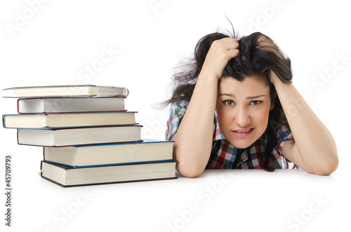 Photo: Tired student with textbooks on white Tired student with textbooks on white