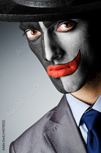 Photo: Businessman with clown face paint Businessman with clown face paint
