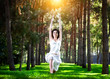 Yoga warrior pose in park