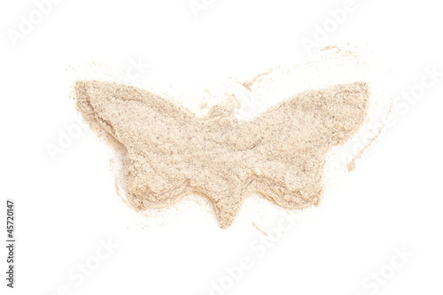 Photo: Heap ground White Pepper isolated in butterfly shape on white ba Heap ground White Pepper isolated in butterfly shape on white ba