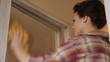 Video: Woman cleaning window sequence Woman cleaning window sequence