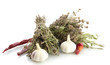 dried herbs in mortar and vegetables, isolatrd on white
