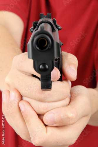 Photo: teens hand with gun, gangster teens hand with gun, gangster