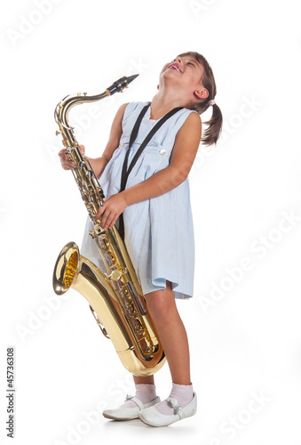 Photo: Bambina suona il sassofono Bambina suona il sassofono