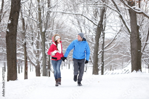 Photo: Couple walking in winter forest Couple walking in winter forest