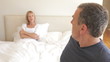 Senior Couple Arguing In Bedroom