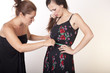 Photo: Two attractive women with measuring tape Two attractive women with measuring tape