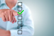 business man designed on a checklist box