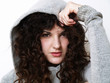 Young woman in hood posing
