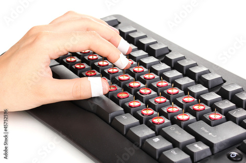 Photo: Painful typing on keyboard close-up Painful typing on keyboard close-up
