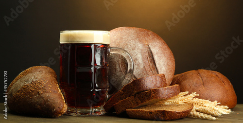 Photo: tankard of kvass and rye breads with ears, tankard of kvass and rye breads with ears,