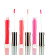 Photo: beautiful lip glosses, isolated on white beautiful lip glosses, isolated on white