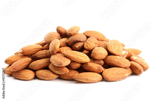Photo: tasty almonds nuts, isolated on white tasty almonds nuts, isolated on white