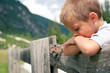 Foto: Portrait of four year old boy outdoors in the mountains. Portrait of four year old boy outdoors in the mountains.