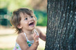 One year little girl playing in the park portrait.