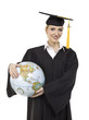 female graduate with globe