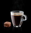 cup of coffee with a chocolate bonbon