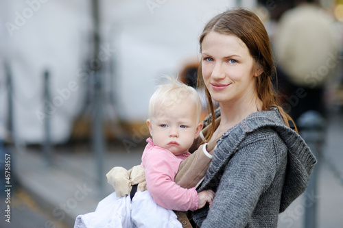 Photo: Young mother and her baby girl Young mother and her baby girl