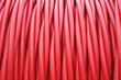storage of Red cord coiled around a Coil