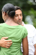a man comforting his wife