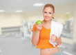 Sporty woman with apple