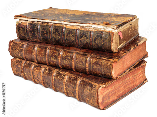 Photo: Three seventeenth century antique books isolated on white Three seventeenth century antique books isolated on white