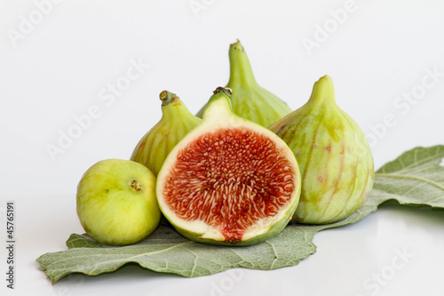 Photo: Green figs on fig leaf Green figs on fig leaf