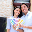 Couple painting their house