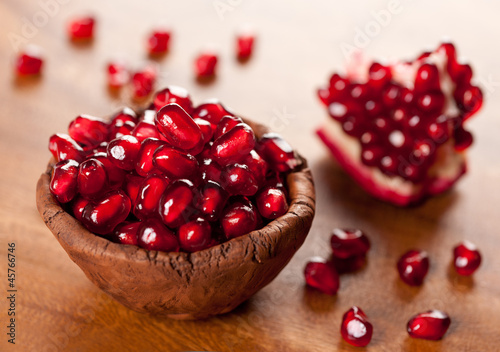 Photo: Ripe pomegranate in a bowl Ripe pomegranate in a bowl