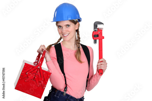 Photo: Female worker with a toolbox. Female worker with a toolbox.