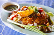 Barbecued and crispy pork in red sauce with rice
