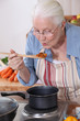 A grandmother cooking.