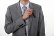 Businessman putting a pen in his pocket