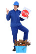 Construction worker encouraging people to recycle